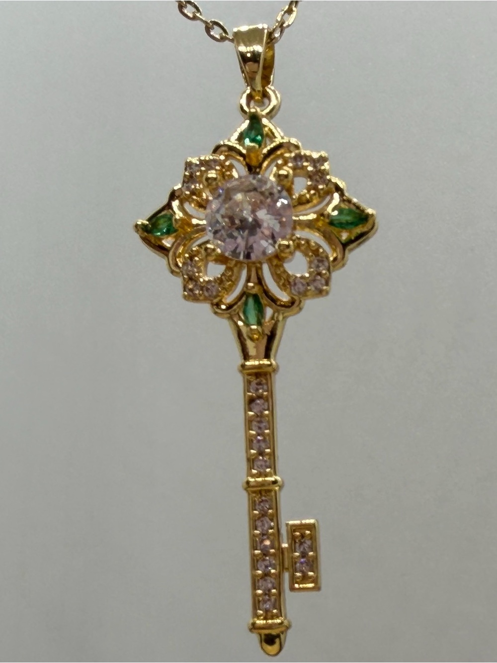 Gold-Tone Key Pendant Necklace with Green and Clear Stones